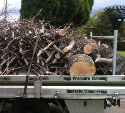 Rubbish piled on the back of a Greener Property Maintenance ute.