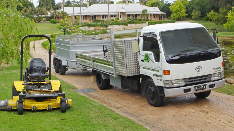 Greener Property Maintenance truck and ride-on mower.