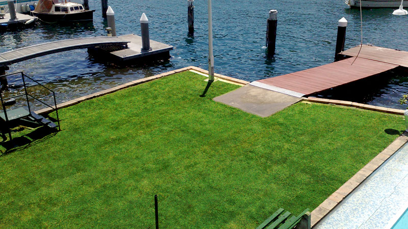 Newly laid turf at a waterfront property.