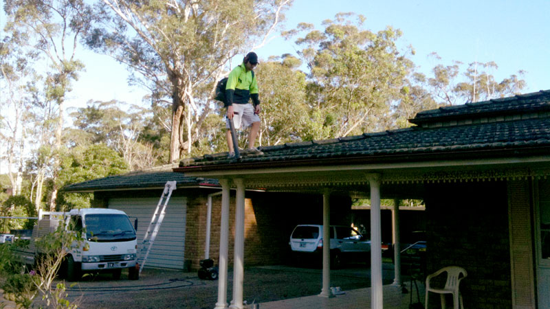 A gutter being cleaned.