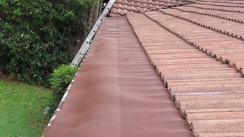 An installed gutter guard.